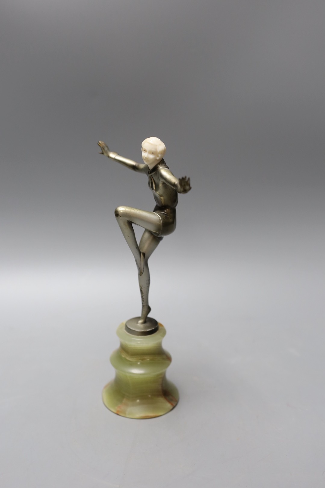 Josef Lorenzl (1892-1950) - Cold painted bronze and ivory figure of a female dancer, raised on an onyx stand, signed 